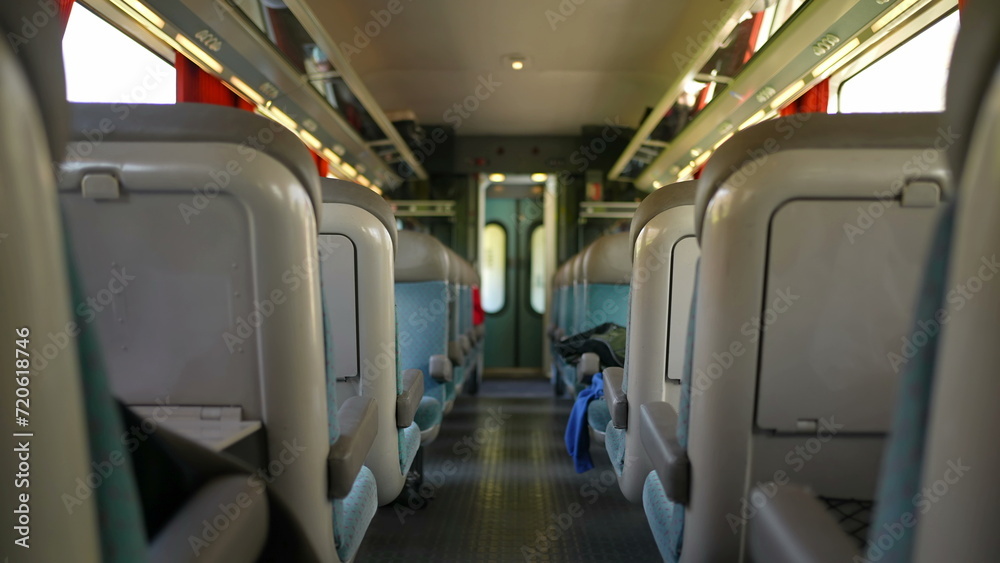 Train corridor interior in motion, walking forward while traveling. European high-speed transportation