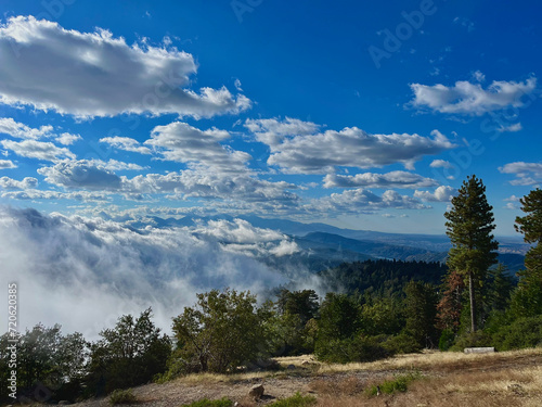 Clouds rolling over and in mountains storm
