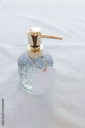 A bottle of perfume on a white background. Shallow dof.