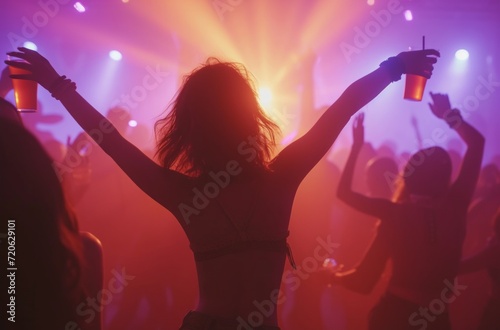 a girl and others dance and drink at a music party dance party