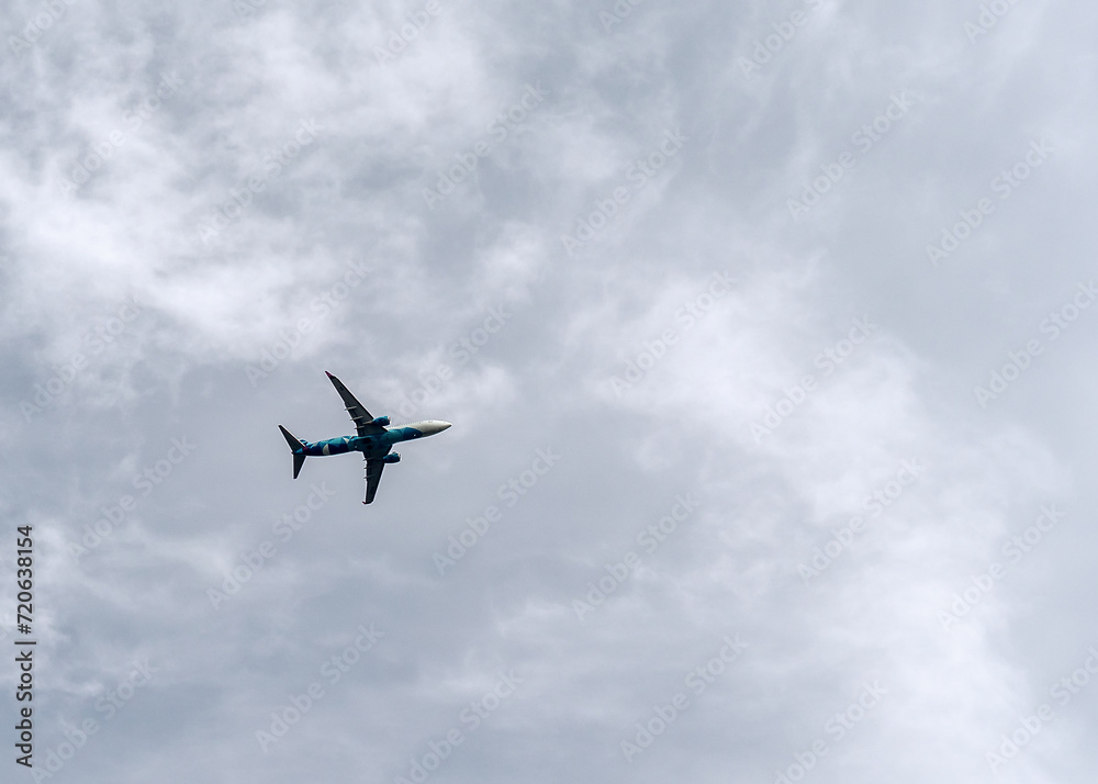A passenger plane is flying in the sky. A passenger plane is flying in the sky.