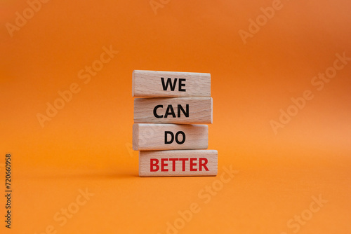 We Can Do Better symbol. Concept words We Can Do Better on wooden blocks. Beautiful orange background. Business and We Can Do Better concept. Copy space.