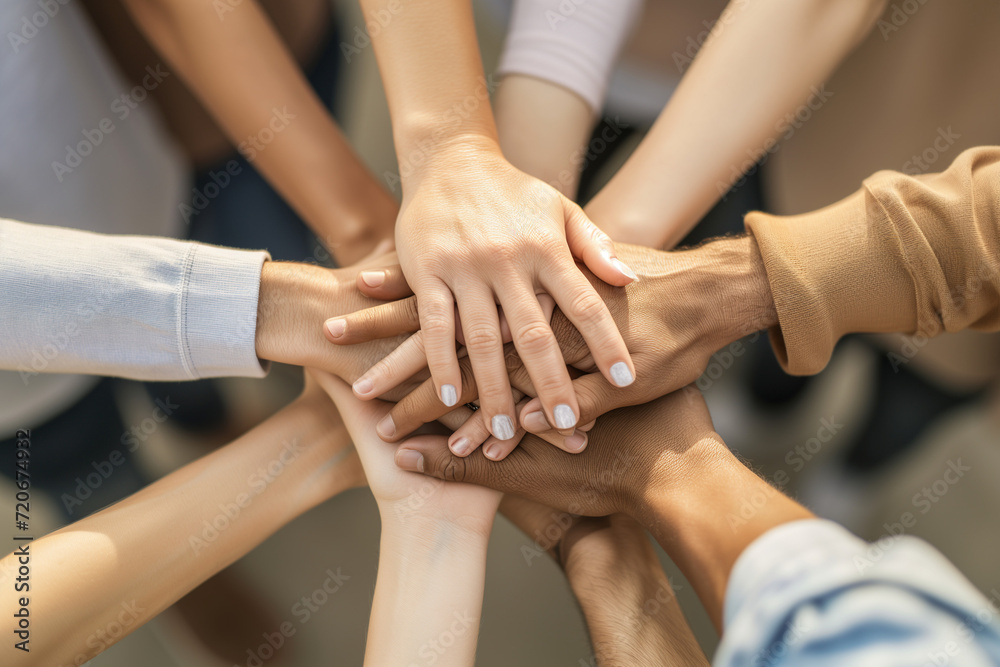 Team putting their hands on the center. Diverse group hands together. Team unity with cultural blend. People gathering in a symbolic center, showcasing teamwork, diversity, and cultural richness. Team putting their hands on the center. Diverse group hands together. Team unity with cultural blend. People gathering in a symbolic center, showcasing teamwork, diversity, and cultural richness.