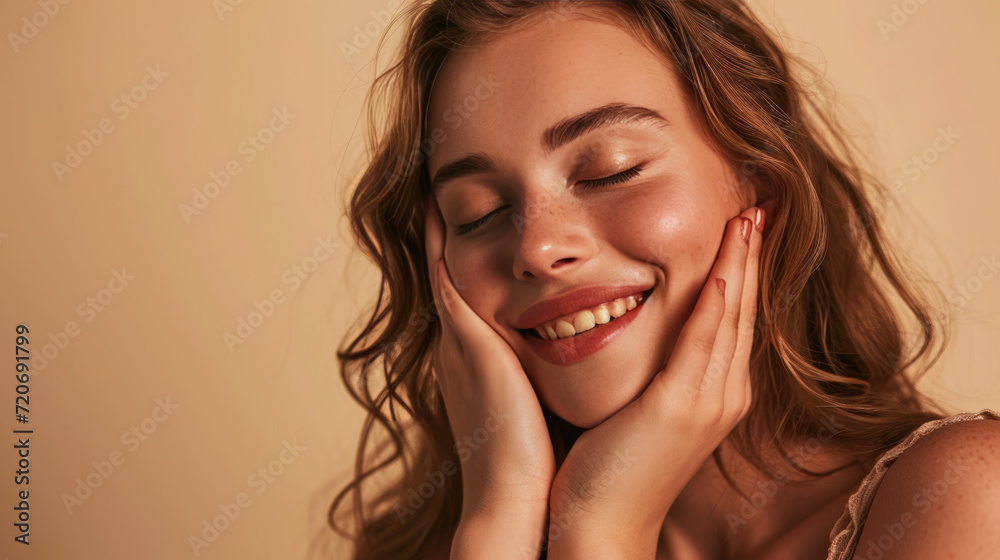 Smiling woman with a hand gently touching her face, displaying clear skin and a joyful expression. Smiling woman with a hand gently touching her face, displaying clear skin and a joyful expression.