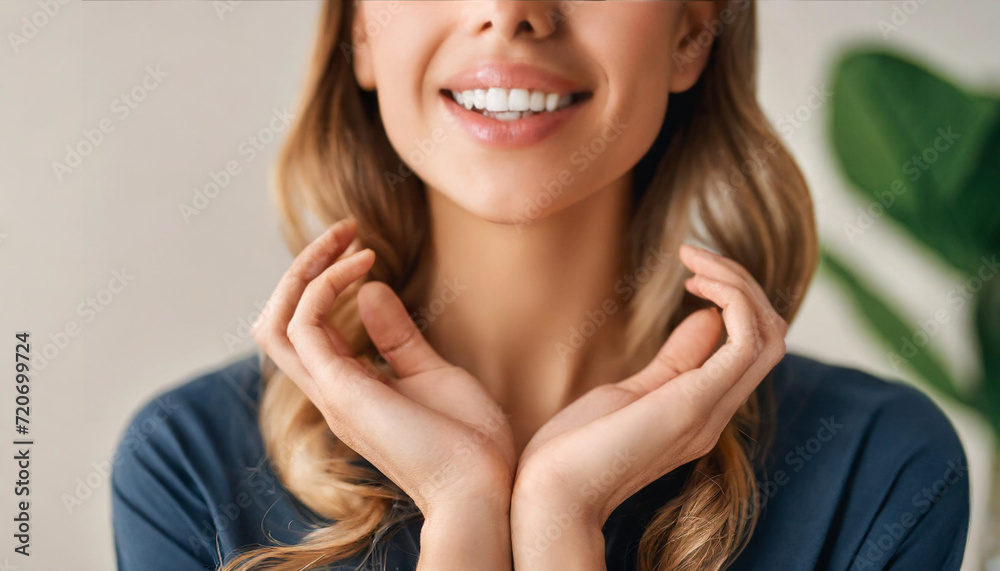 hands delicately grace flawless bare neck and shoulder, symbolizing skin care and purity on a clean background in this stock photo