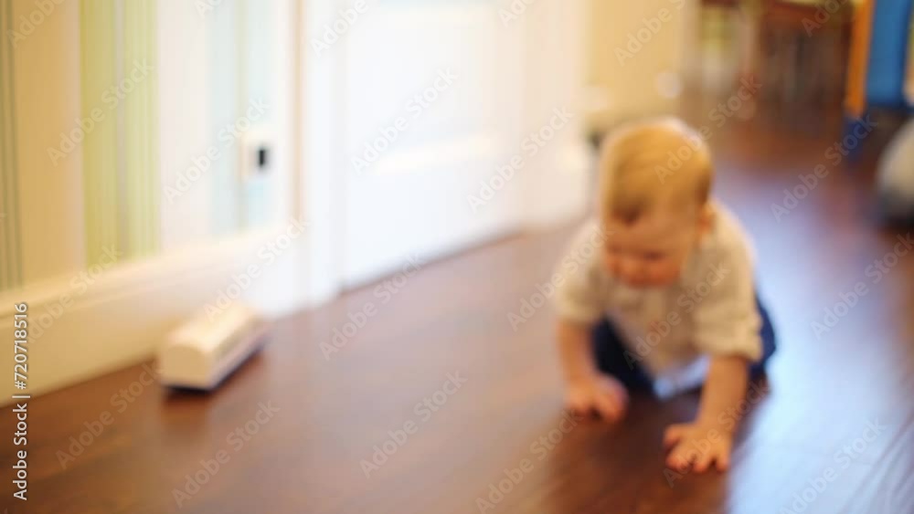 Toddler crawling to his mother and back in room, shallow dof Toddler crawling to his mother and back in room, shallow dof