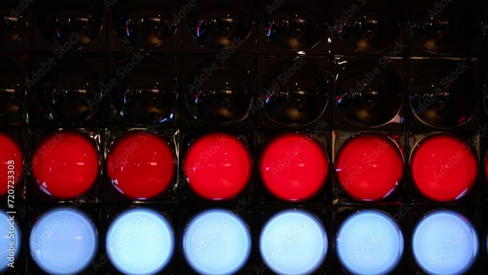 A wall with rows of colorful lights changing color