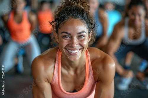 Healthy and happy: A woman's radiant smile reflects her enjoyment of an active lifestyle at the gym.