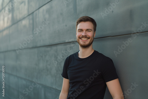 Joyful man in black shirt. Diversity and culture. The image features a smiling individual, emphasizing diversity and cultural richness with a positive and welcoming expression.
