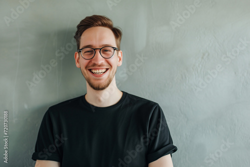 Joyful man in black shirt. Diversity and culture. The image features a smiling individual, emphasizing diversity and cultural richness with a positive and welcoming expression. photo