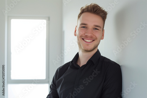 Joyful man in black shirt. Diversity and culture. The image features a smiling individual, emphasizing diversity and cultural richness with a positive and welcoming expression.