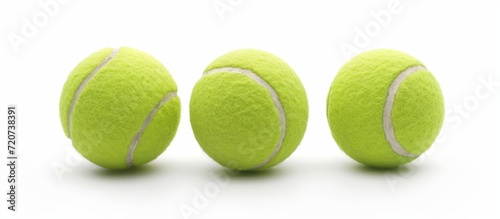 Triple Tennis Ball Isolated on White Background © AkuAku