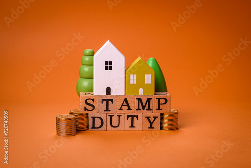 The inscription Stamp Duty made of wooden cubes on a plain background photo