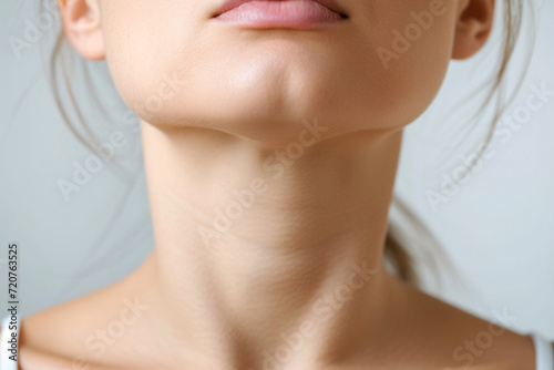 A woman's throat close-up, showing where the thyroid is located
