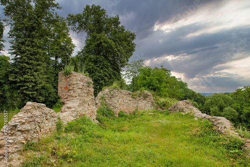 Medieval Halych Castle ruins under stormy sky in Ukraine. photo