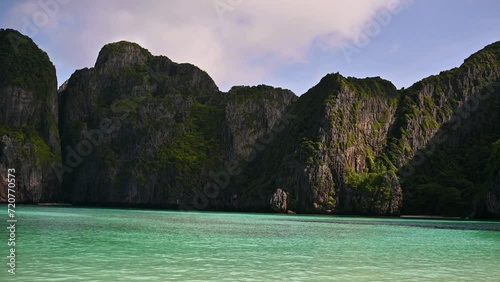 Maya Bay in Phi Phi islands, Thailand. Travel to Thailand, vacation, beautiful places. Tropical islands. Cristal water. Yachts and boats photo