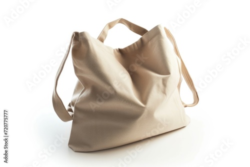 A large beige bag sitting on top of a white surface. Perfect for showcasing products or for a minimalist aesthetic