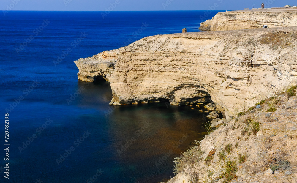 Steep steep coast of limestone rocks in the western Crimea, Tarkhankut Peninsula