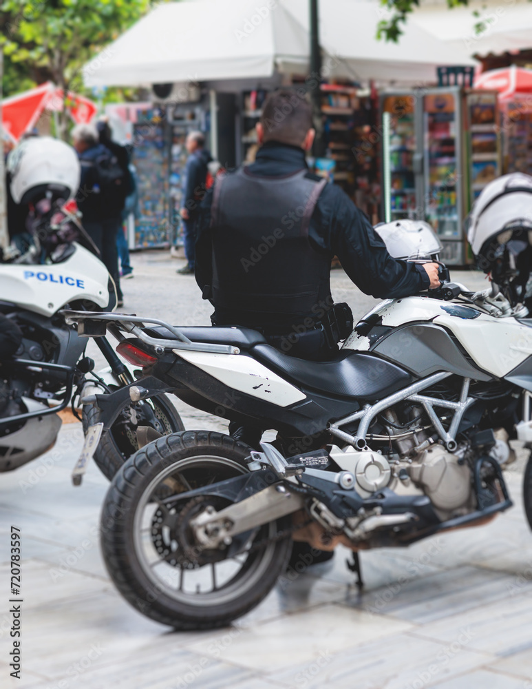 Police squad formation on duty riding bike and motorcycle, maintain public order in the european city streets, group of policemen patrol on motorbikes with 