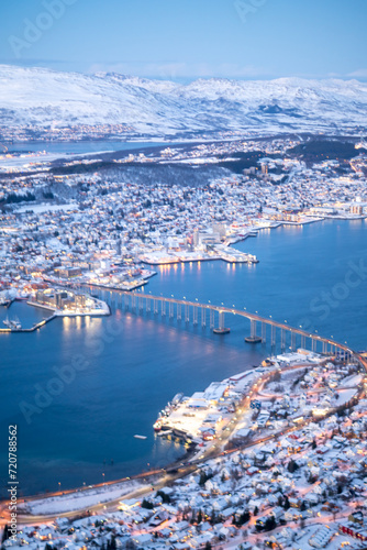 Fjellheisen viewpoint over tromso city in north of norway in winter time with the sunset over the fjords