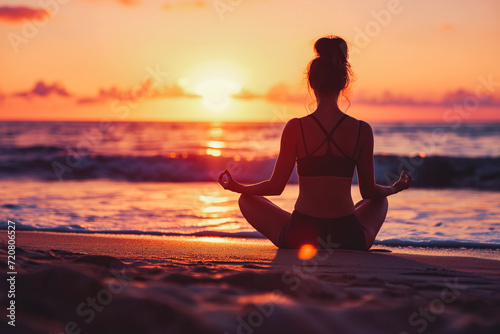 Woman practicing mantra yoga meditation outdoors on the beach at sunset achieving peaceful relaxation and spiritual well being She feels very concerned.