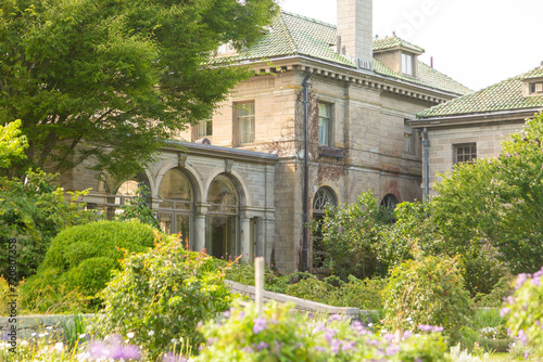 mansion with lush garden in foreground