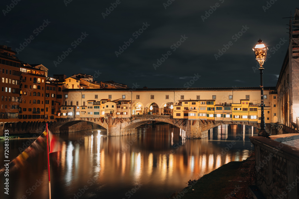 Ponto Vecchio bridge, one of the symbols of Florence. Medieval bridge in the evening.