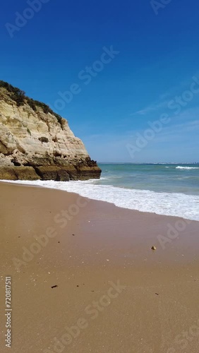 Blue sky with beach rock and ocean waves