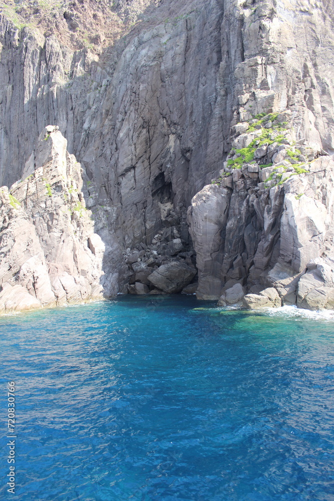 turquoise lagoon close to sicily and stone cliff