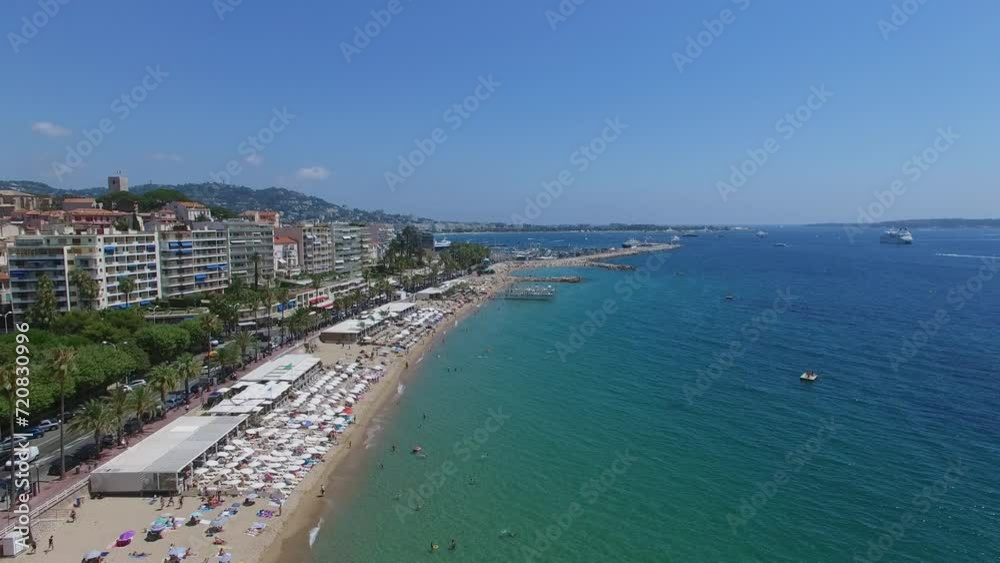 City beach with many people get rest near street with traffic at summer City beach with many people get rest near street with traffic at summer