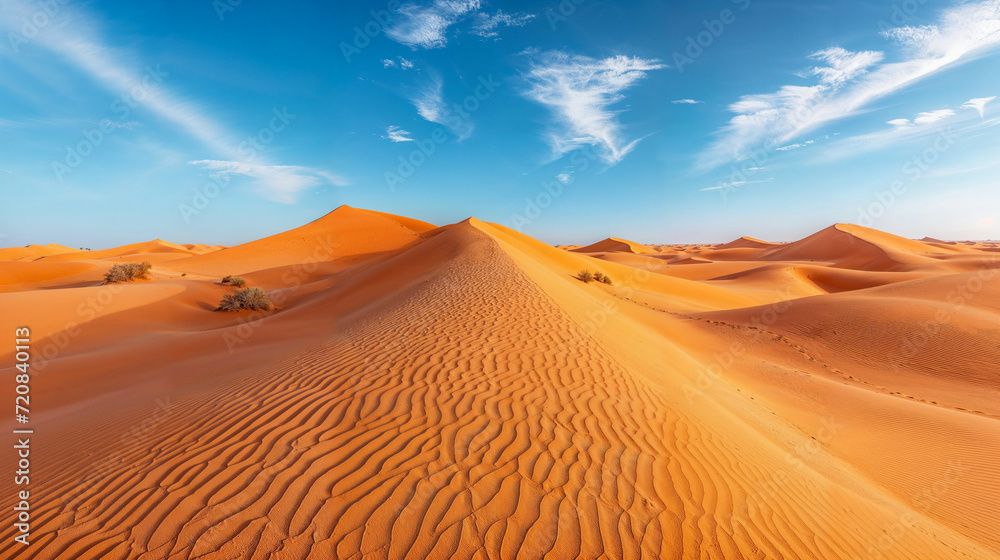 Wispy clouds above a sand dune formation, beautiful majestic desert landscape sand dunes in the Sahara Saharan Desert