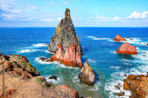 Red rock pillar protruding out of the Atlantic Ocean at the Ponta de São Lourenço (tip of St Lawrence) at the easternmost point of Madeira island (Portugal) photo