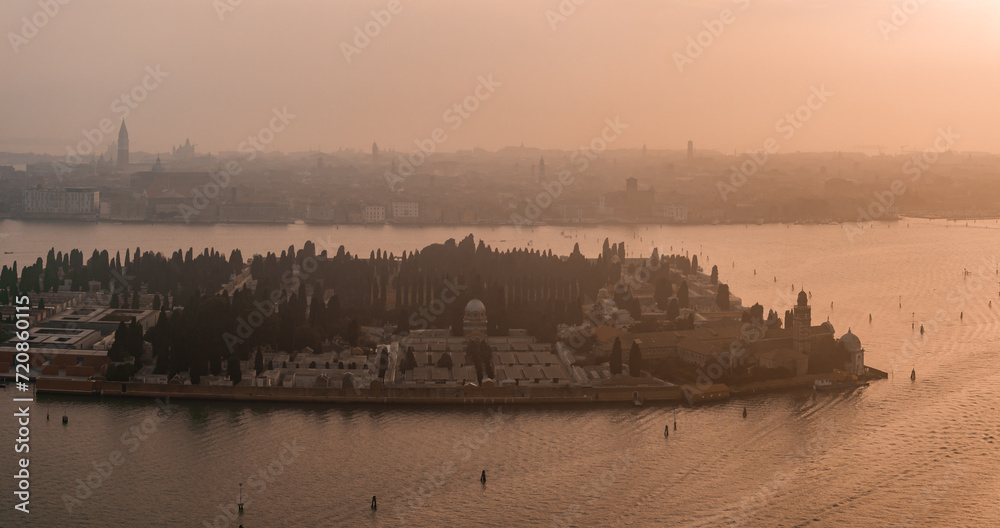 Aerial view of Murano island in Venetian lagoon sea from above, Italy at sunset