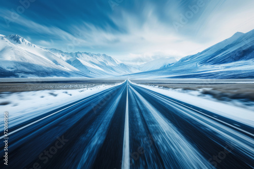 A dynamically blurred road with a sense of speed through mountains.