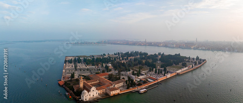 Fototapeta Naklejka Na Ścianę i Meble -  Aerial view of historic Saint Michele cemetery island near Murano and Venice, Italy