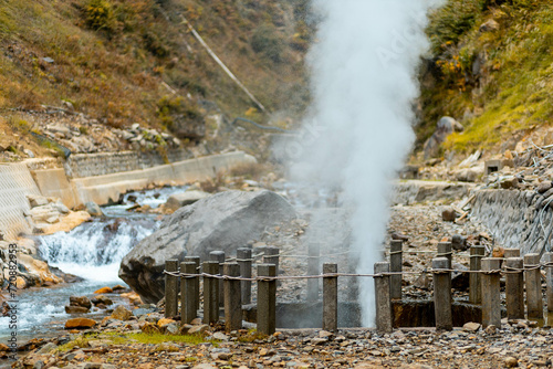 A geyser spout with hot gas coming out of the ground in Japan