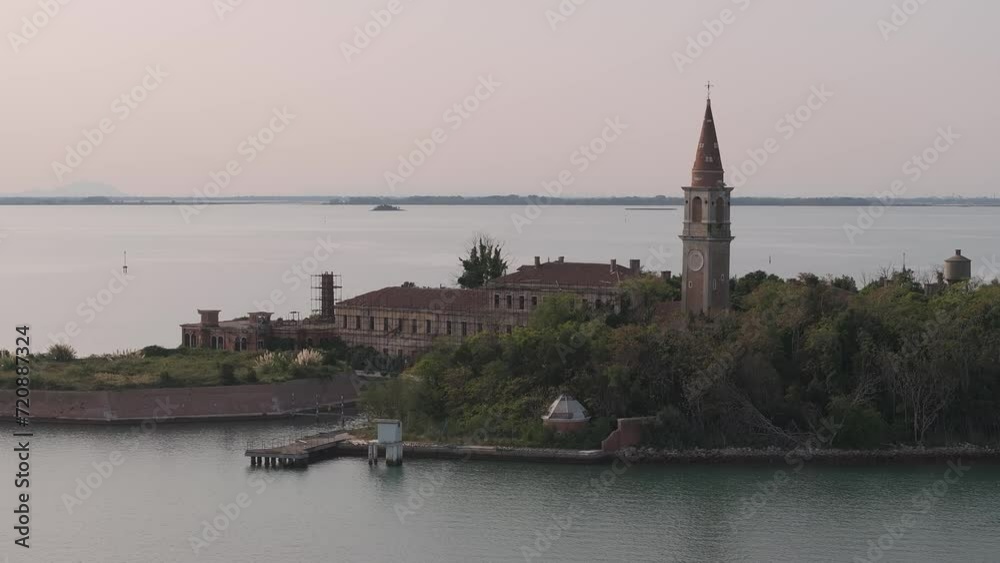 Aerial view of the plagued ghost island of Poveglia in the Venetian lagoon, opposite Malamocco along the Canal Orfano near Venice, Italy. Aerial view of the plagued ghost island of Poveglia in the Venetian lagoon, opposite Malamocco along the Canal Orfano near Venice, Italy.