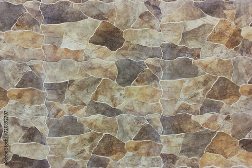 Exterior wall with natural brown stone materials for background texture photo
