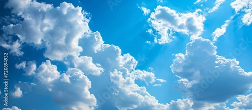 Blue Sky and White Clouds: Captivating Background Depicting the Serenity of the Blue Sky, White Clouds, and Tranquil Background