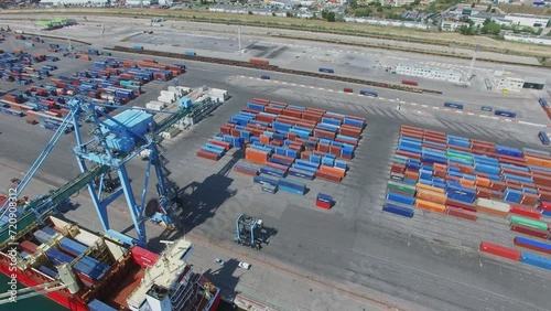 Mourepiane container terminal and barge on moorage under crane  photo