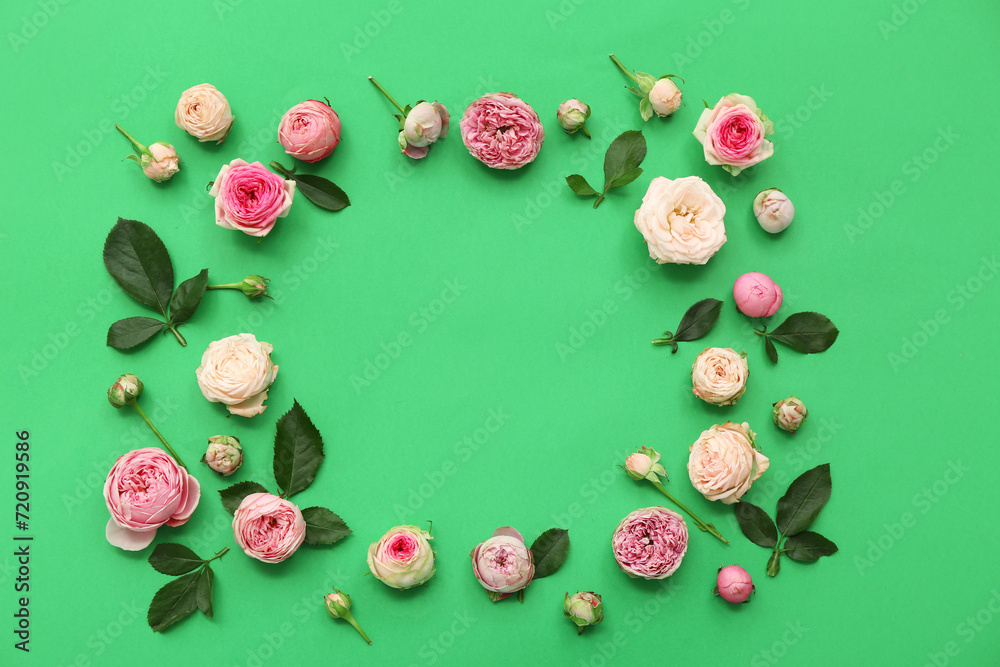 Frame made of beautiful pink roses with leaves on green background Frame made of beautiful pink roses with leaves on green background