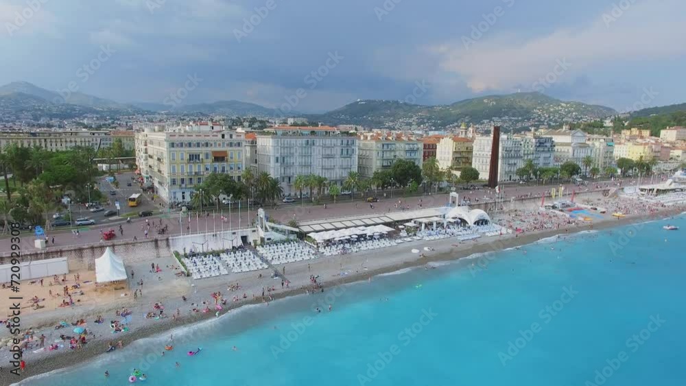 Cityscape with people get rest on sea beach near United States quay Cityscape with people get rest on sea beach near United States quay