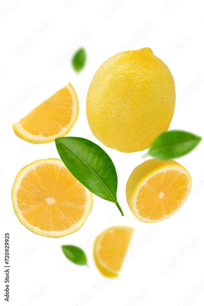 Cut and whole fresh lemons with green leaves falling on transparent background