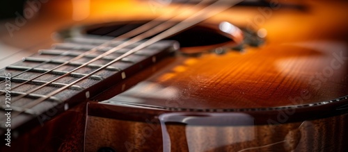 Close Up of a Classic Guitar: An Up-Close Shot Showcasing the Elegance of this Classic Guitar in Exquisite Detail photo