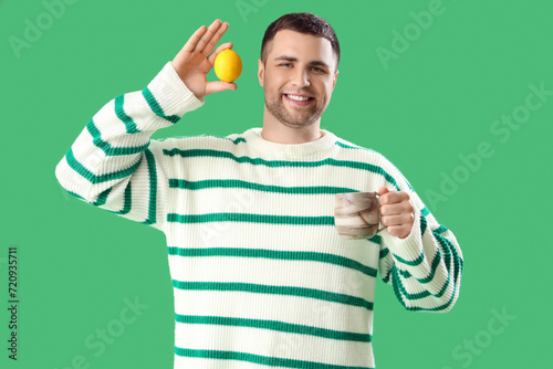 Young man with cup of tea a...