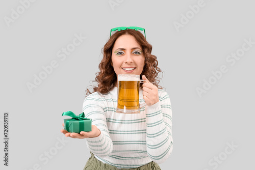 Happy woman with beer and g...