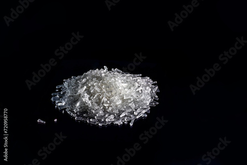 Pile of crystalline matter. Low Key. Flavor enhancer, sodium glutamate photo