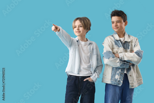 Happy brothers pointing at ...