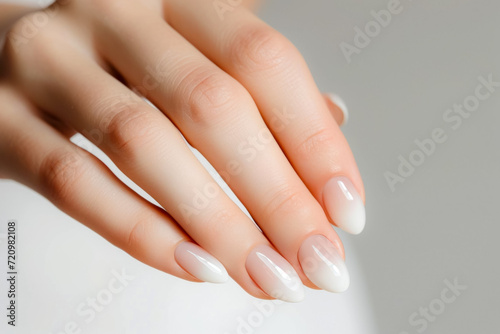Female hands with a beautiful manicure. Backdrop with selective focus and copy space
