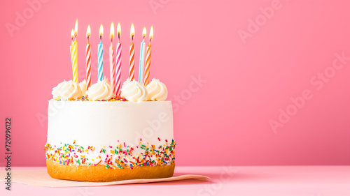 birthday cake with pink pastel background and copy space 